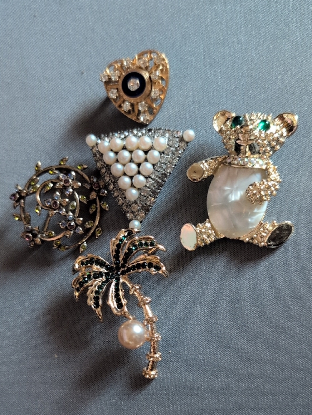 5 gold and silver tone brooches (1 stamped Monet)
